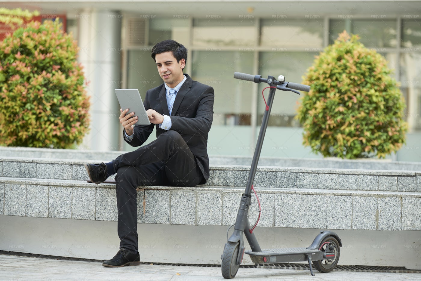 Businessman Using Tablet Pc In The City: Stock Photos