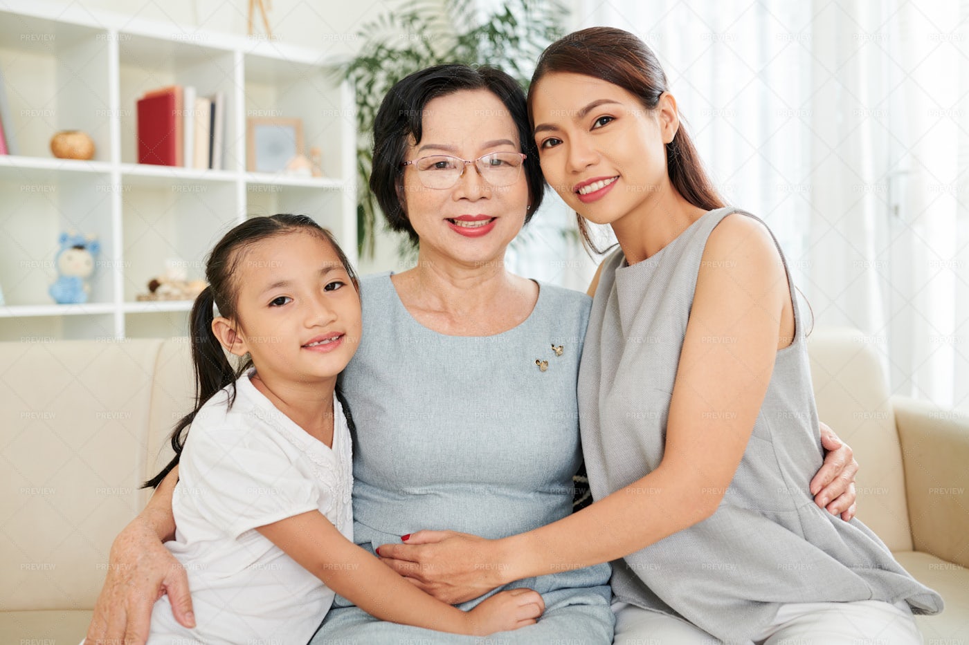 Happy Asian Family At Home: Stock Photos