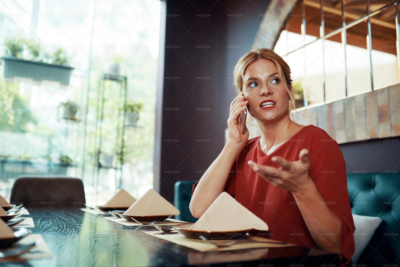 Woman Sitting At Restaurant And Talking: Stock Photos