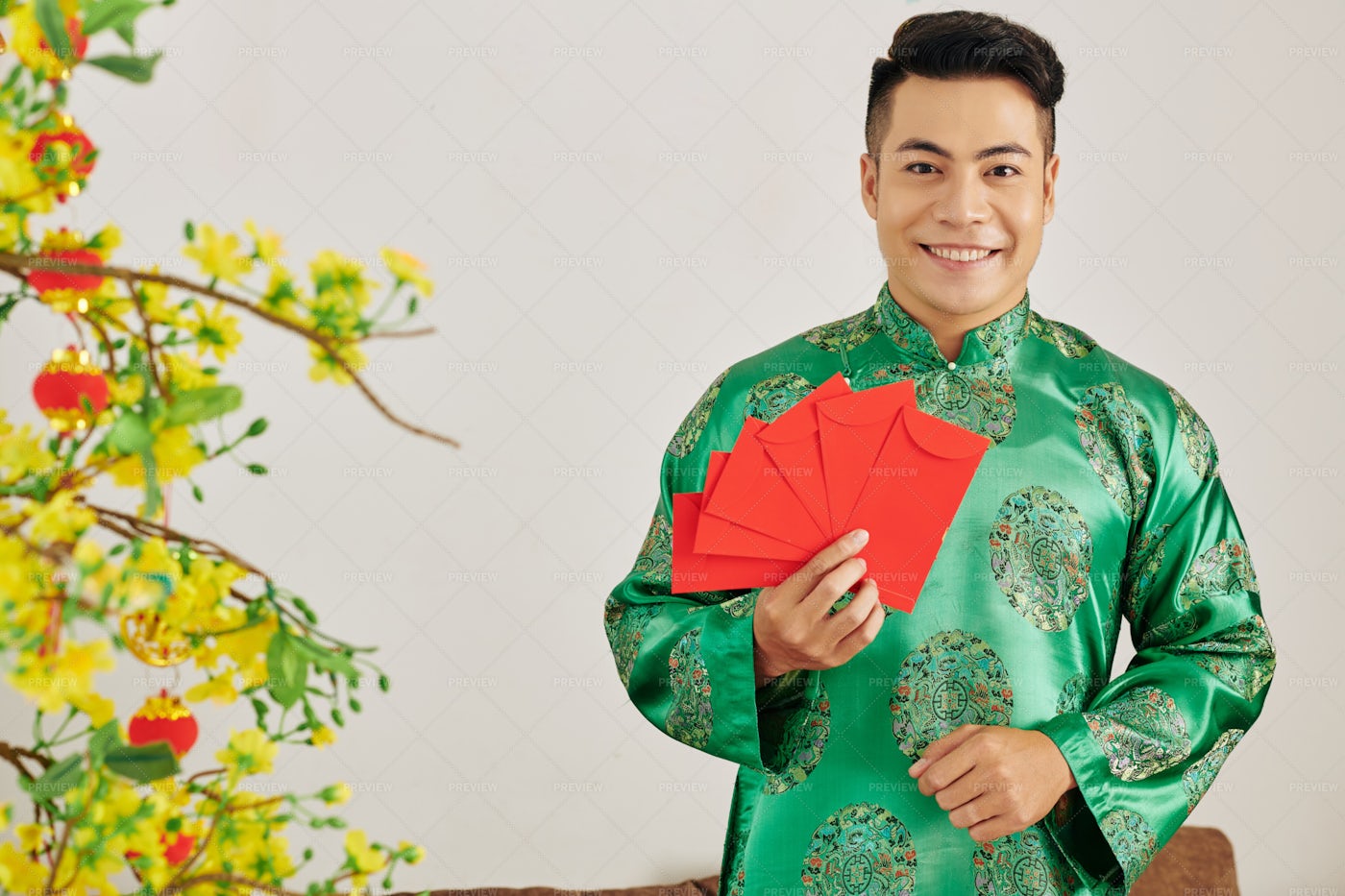 Young Man With Red Envelopes: Stock Photos