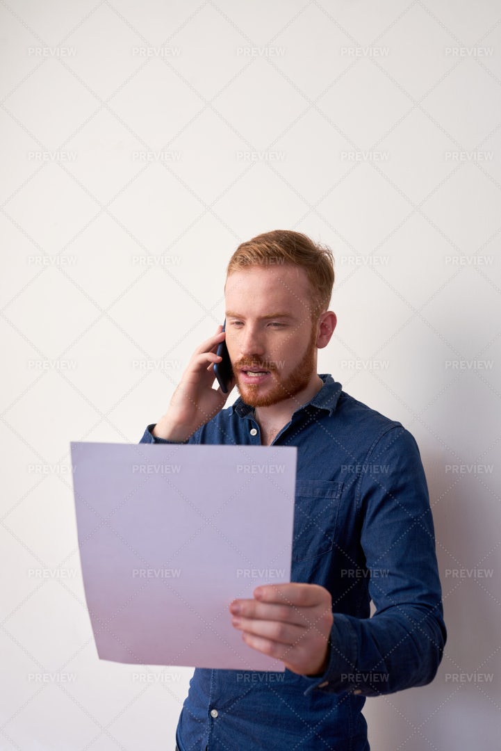 Entrepreneur Reading Important Document: Stock Photos