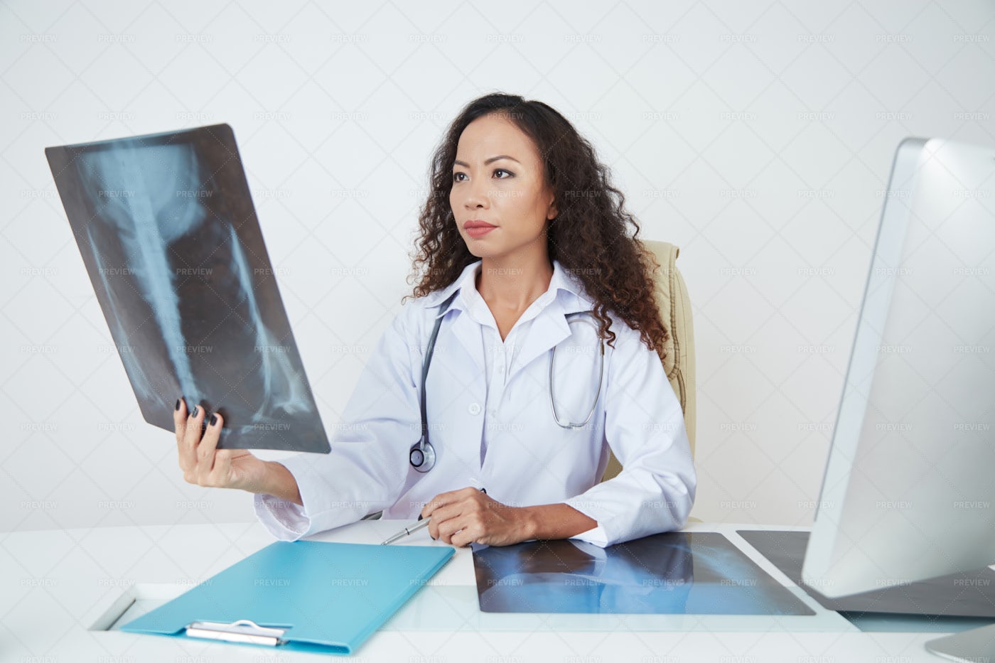 Doctor Examining Chest X-ray: Stock Photos