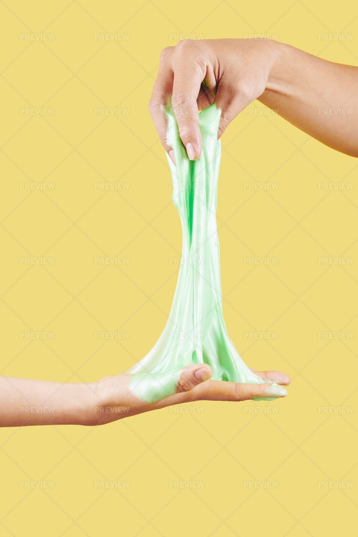 People Stretching Slime: Stock Photos
