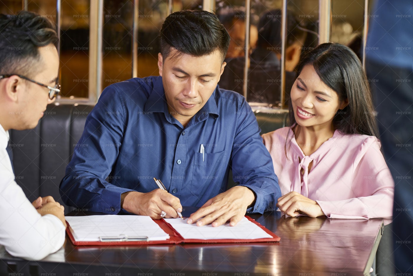 Signing Contract With Real Estate Agent: Stock Photos