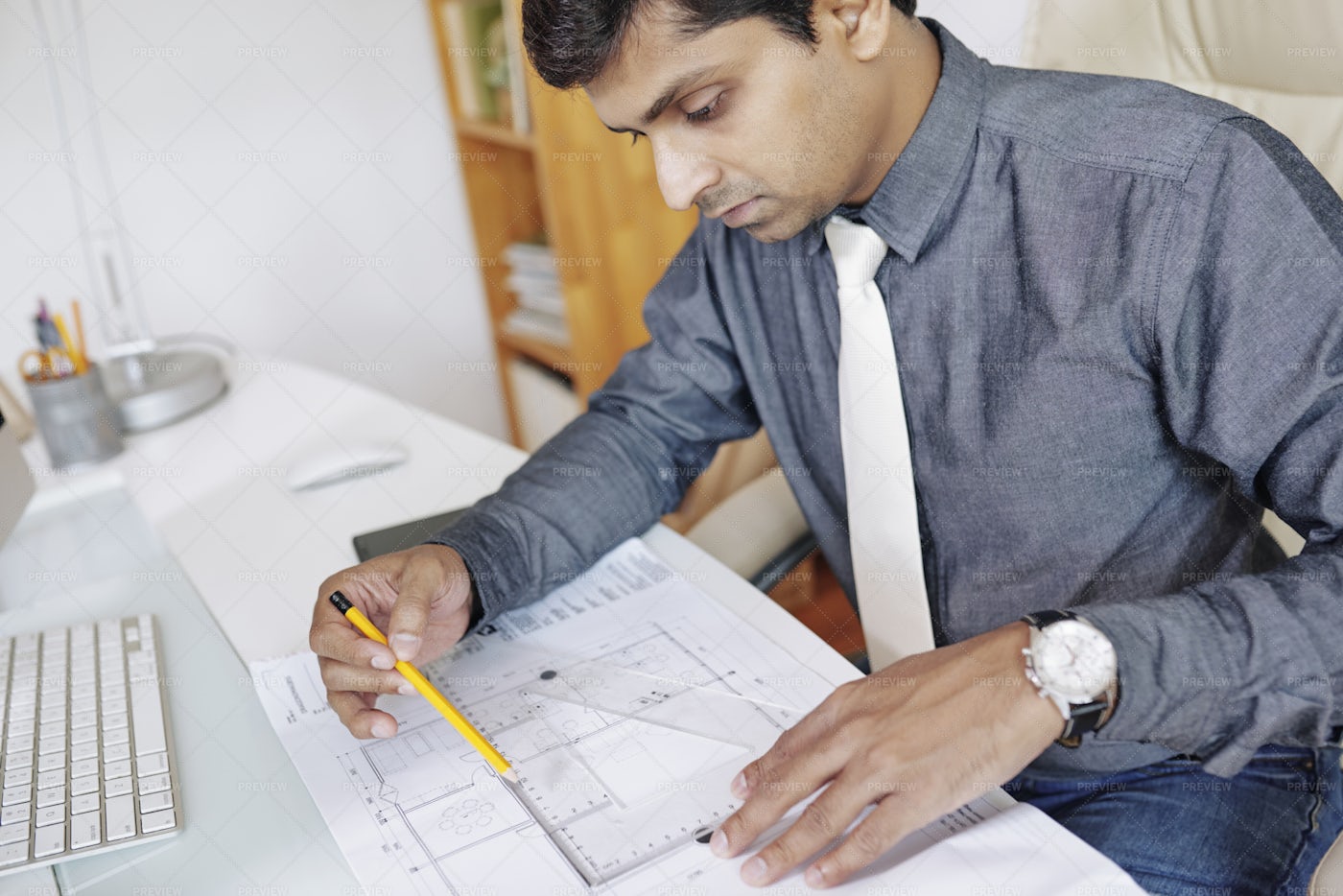 Engineer Measuring Blueprint: Stock Photos