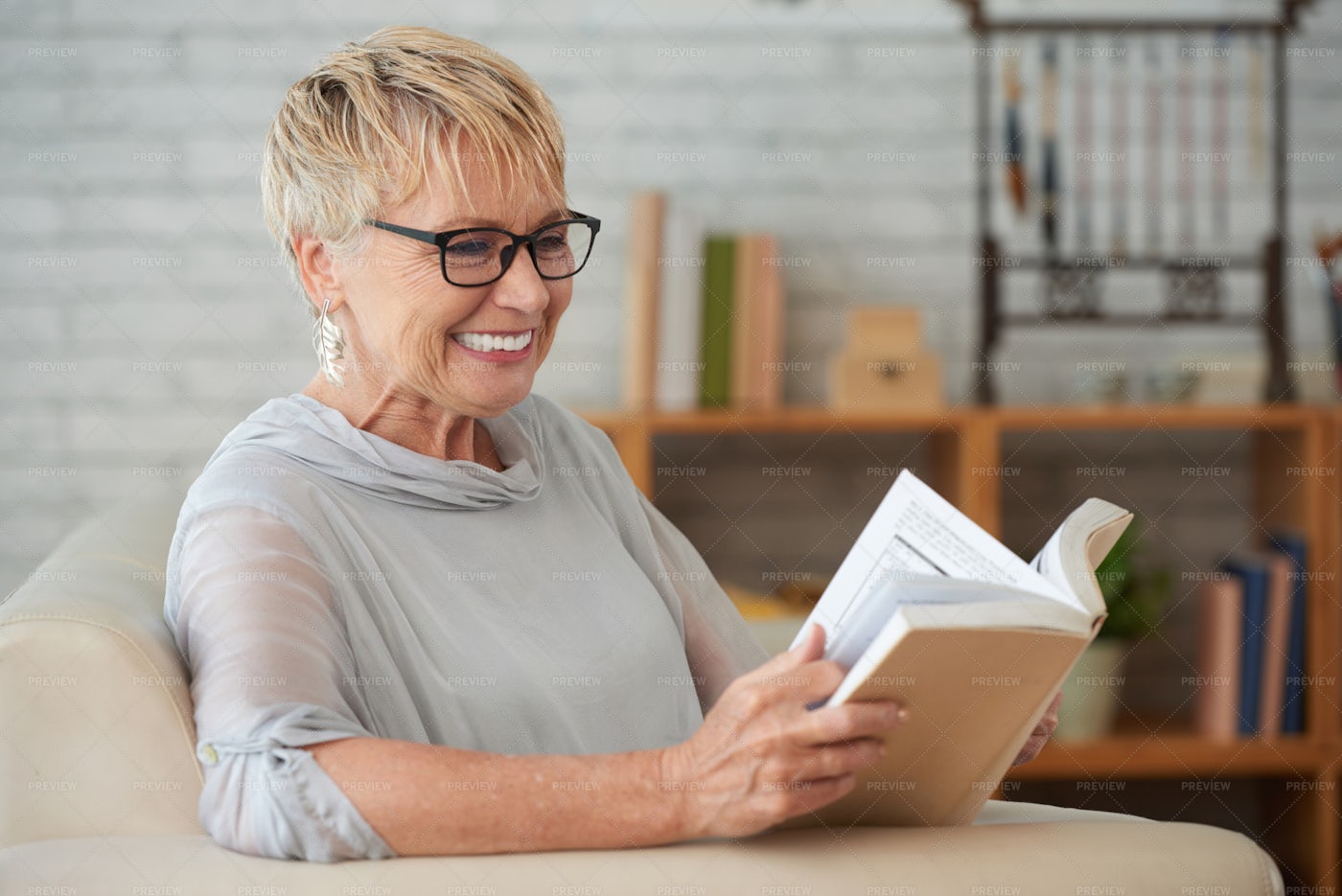 Woman Resting With Book At Home: Stock Photos