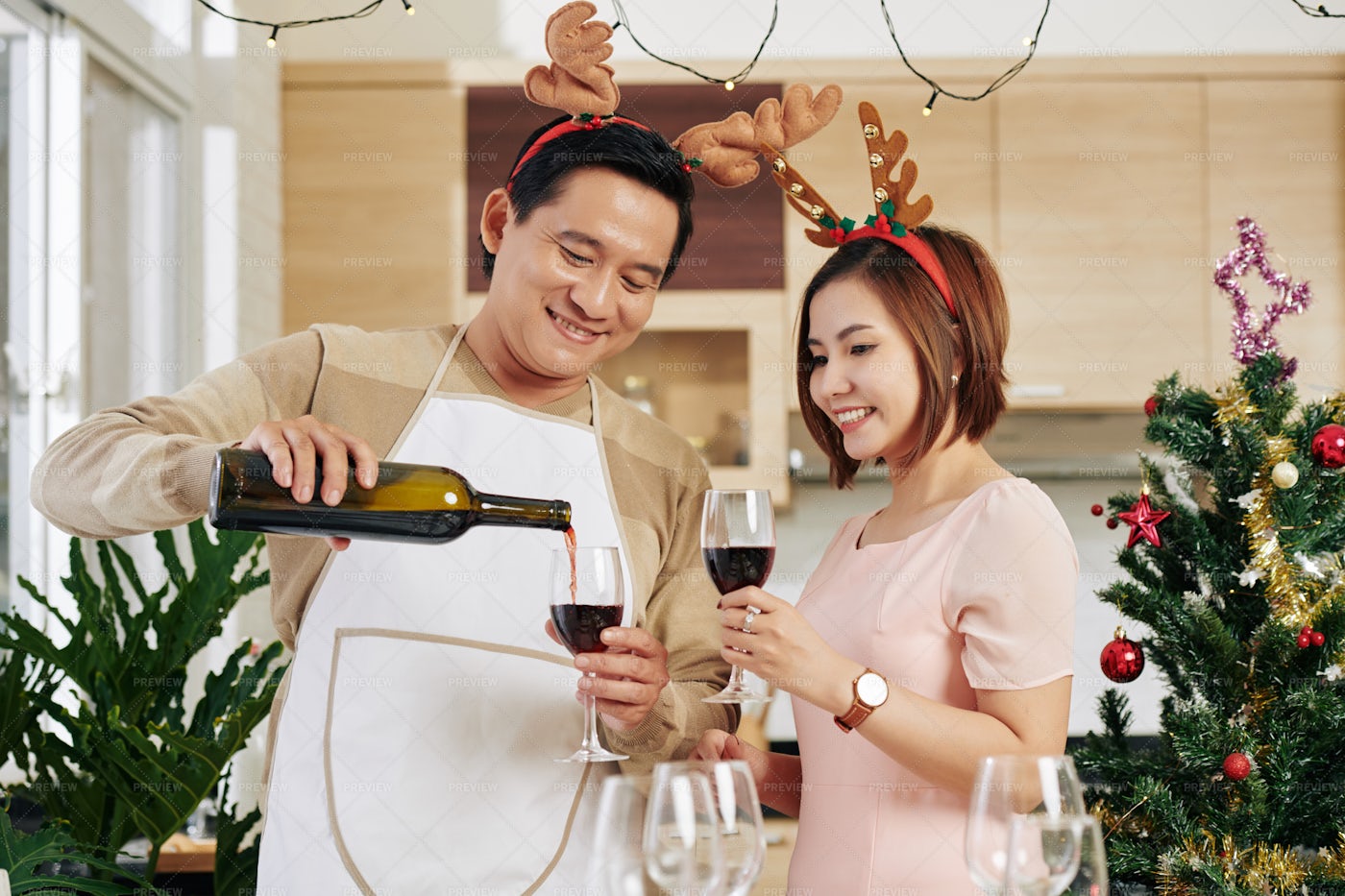 Man Pouring Wine On Christmas Eve: Stock Photos