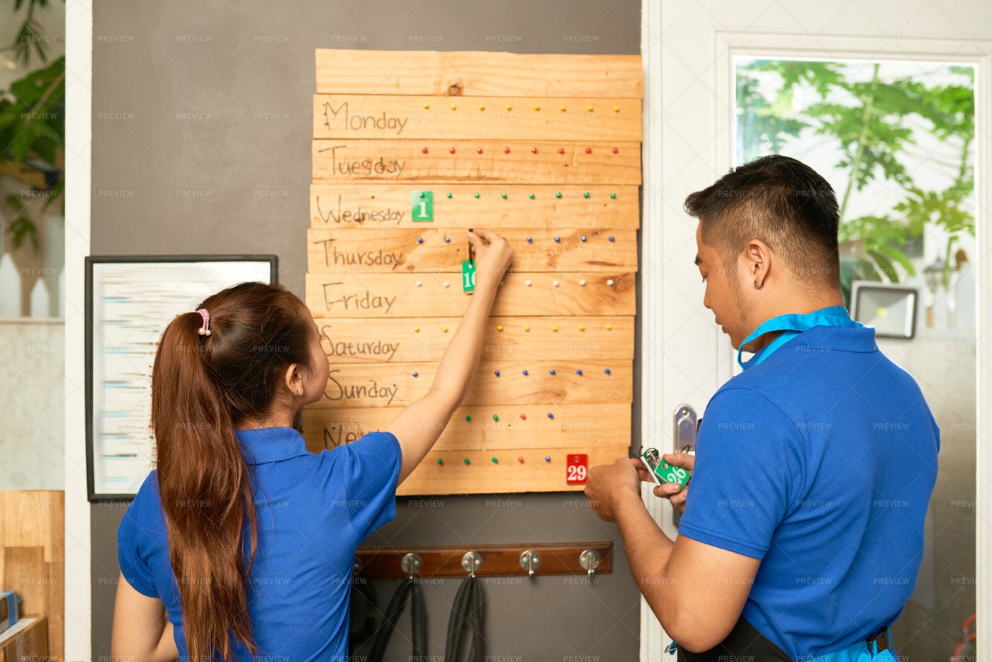 Sales Assistants Checking Progress: Stock Photos