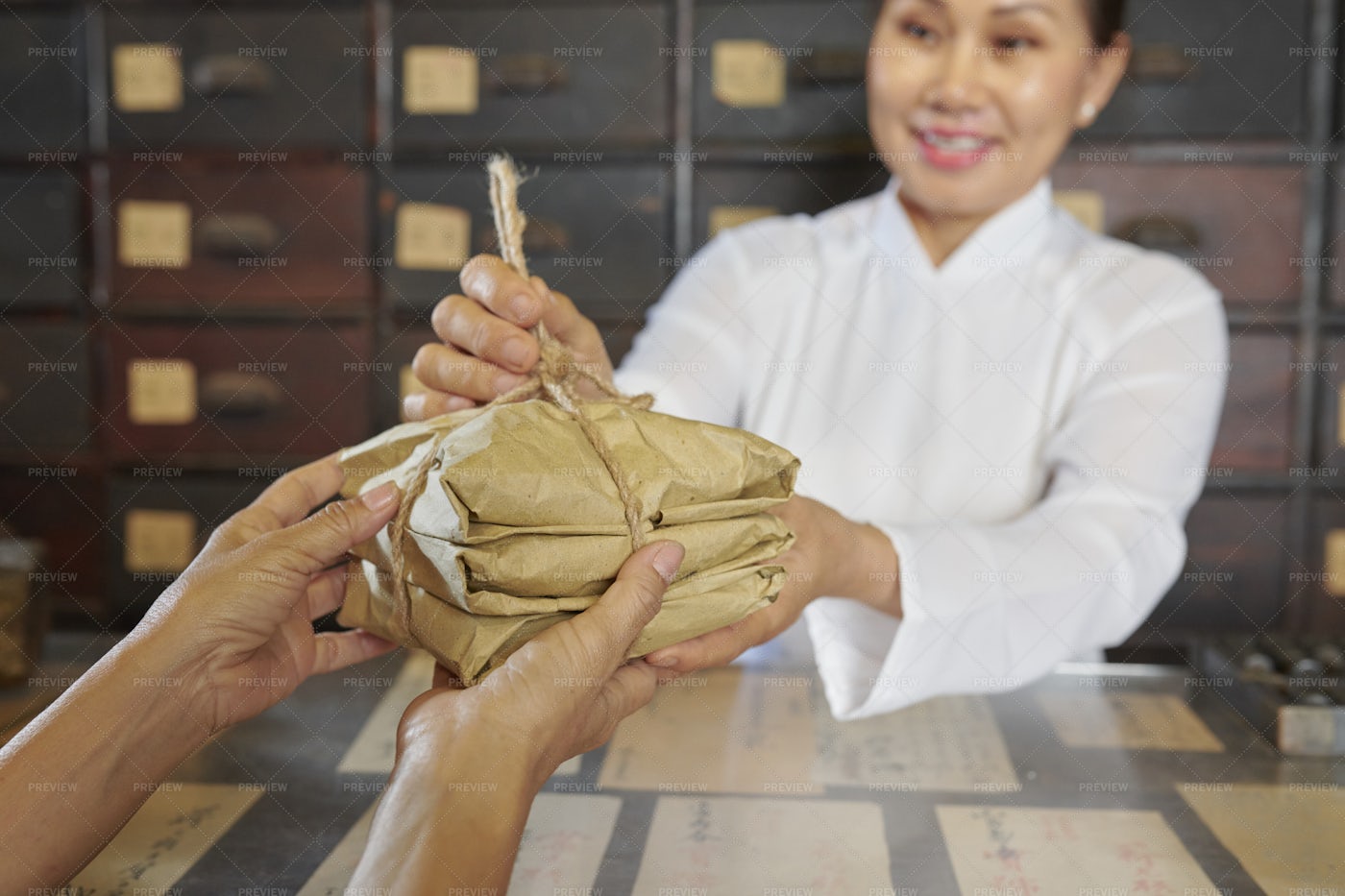Woman Selling Herbs In Apothecary: Stock Photos