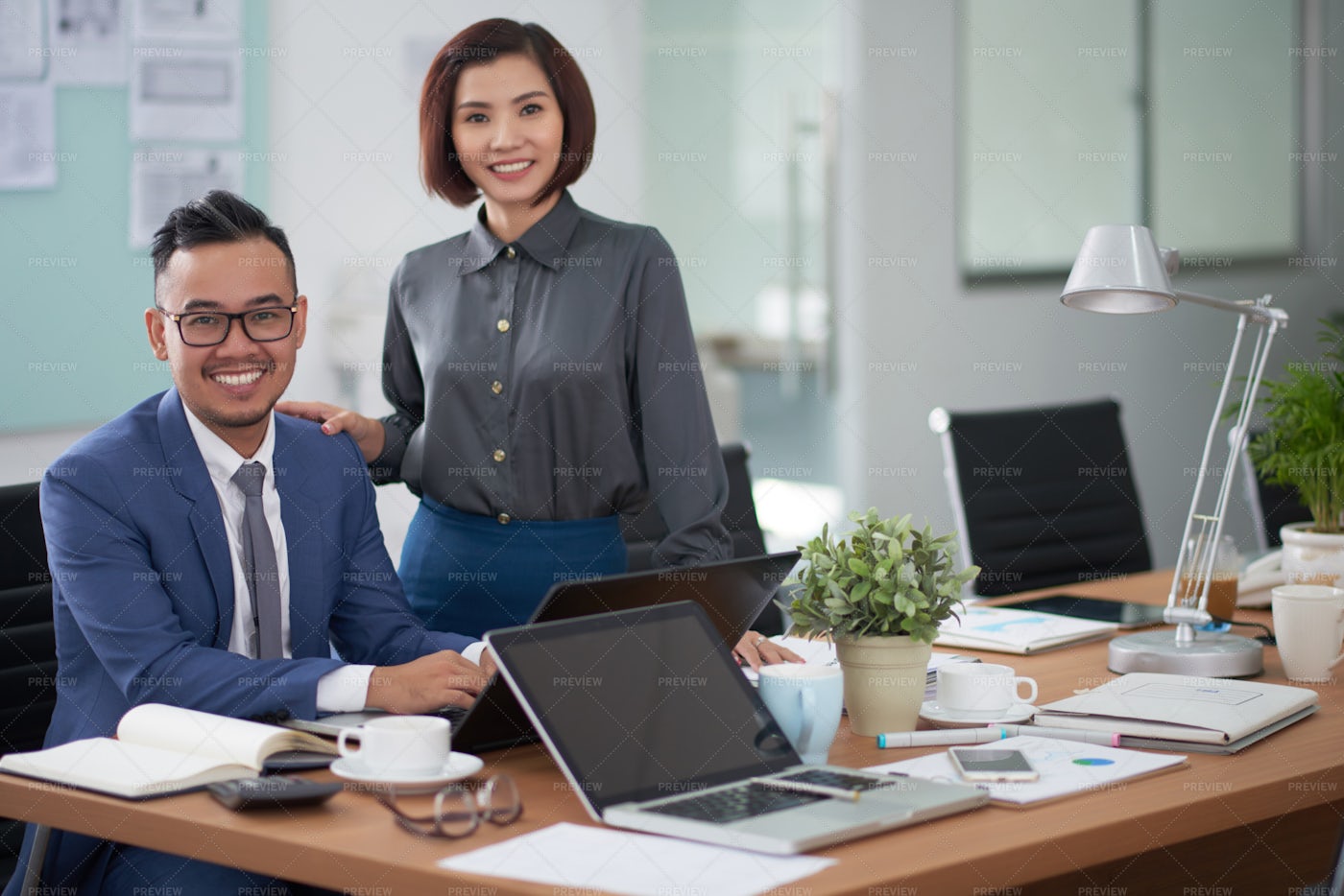 Successful Business Partners At Office: Stock Photos