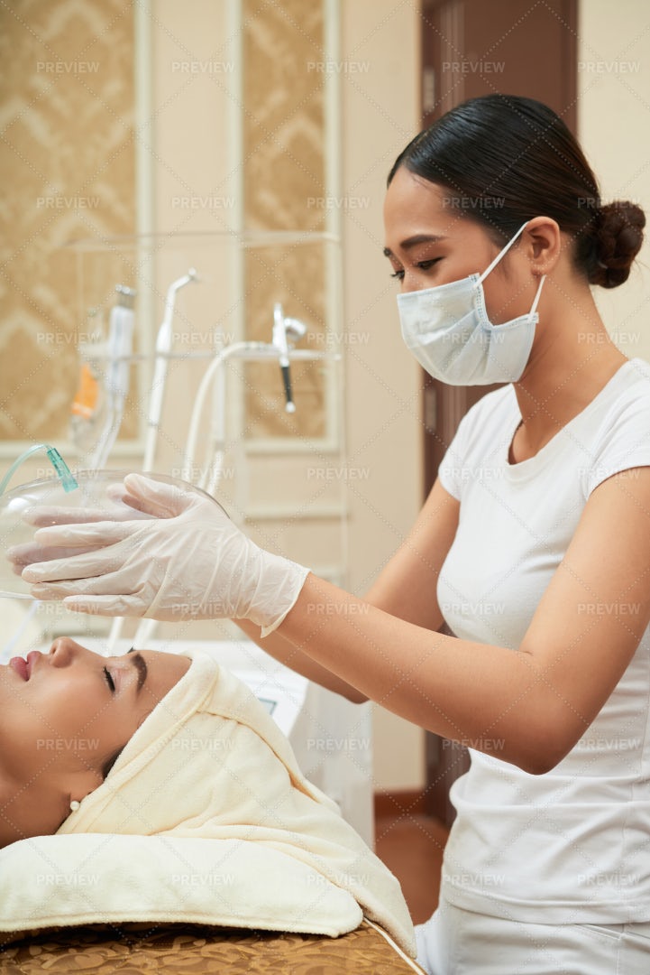 Cosmetologist Making Facial Procedure: Stock Photos