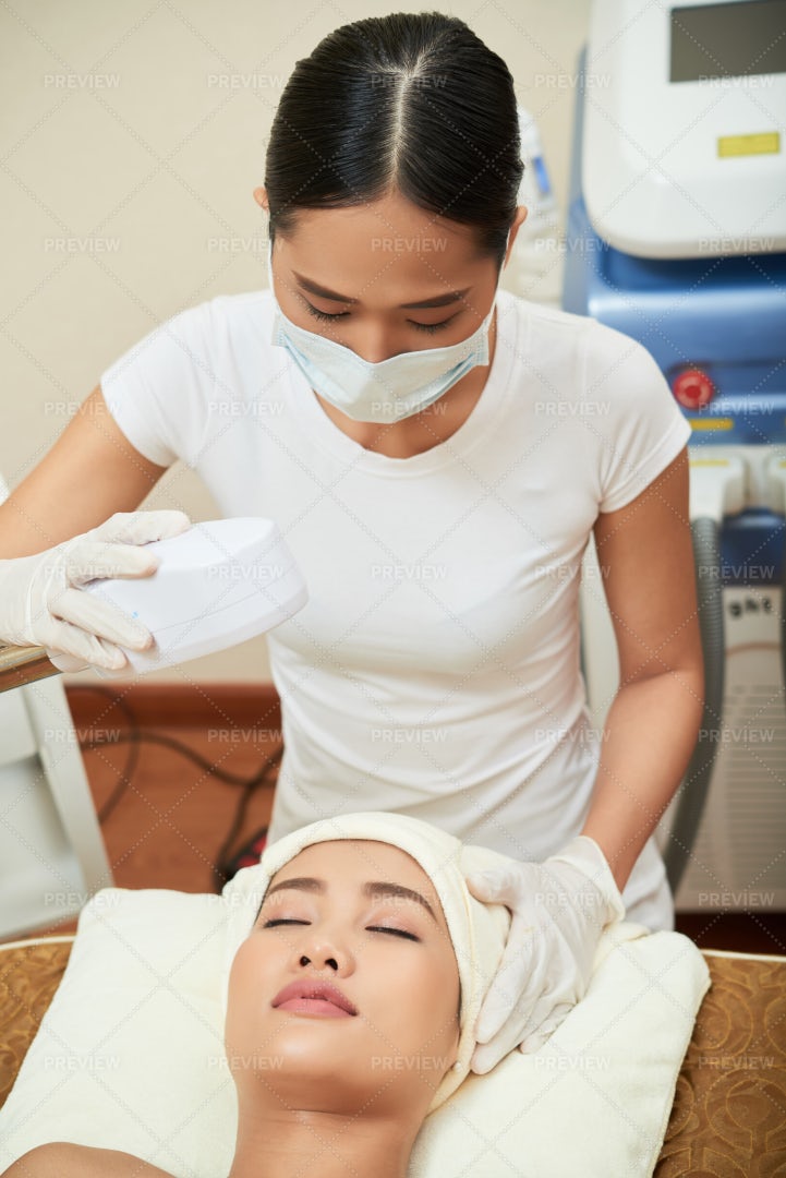 Laser Therapy For Face In Spa Salon: Stock Photos