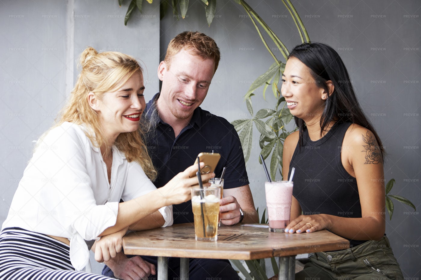 Cheerful Friends Resting In Cafe: Stock Photos