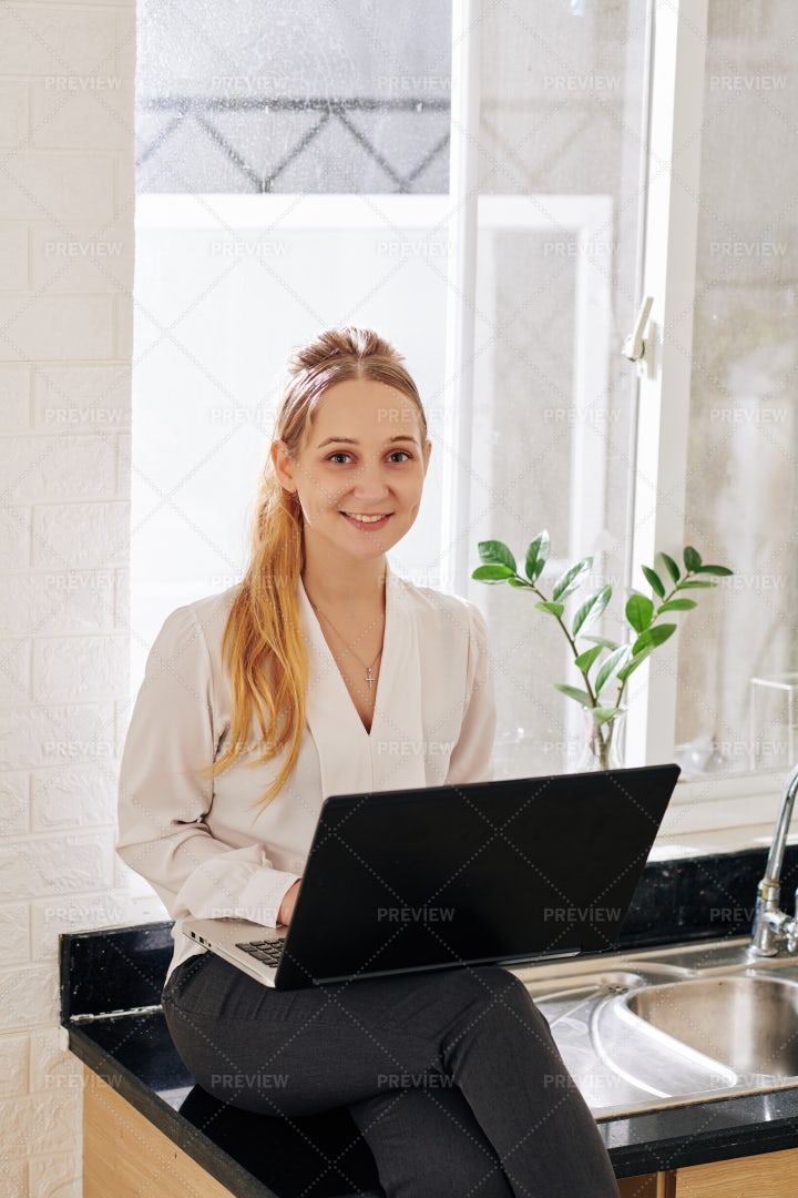 Businesswoman Working On Laptop At Home: Stock Photos