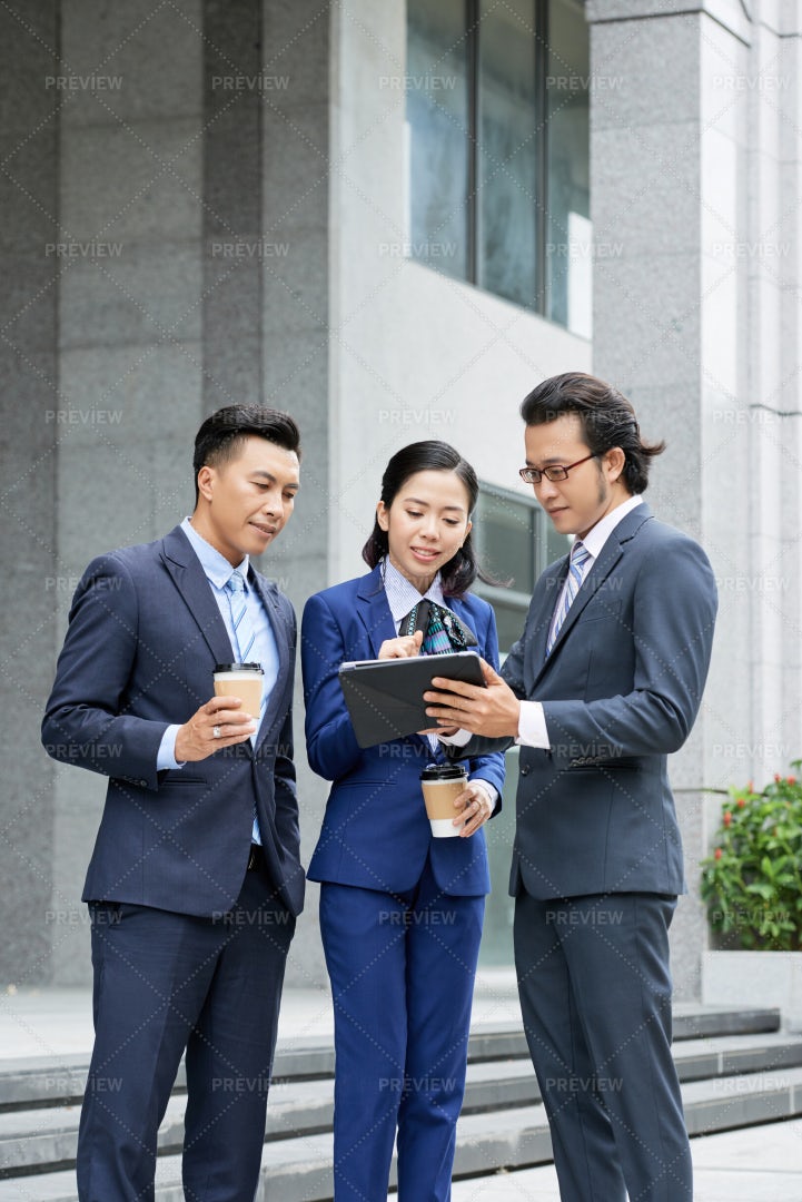 Business Partners Discussing Online: Stock Photos