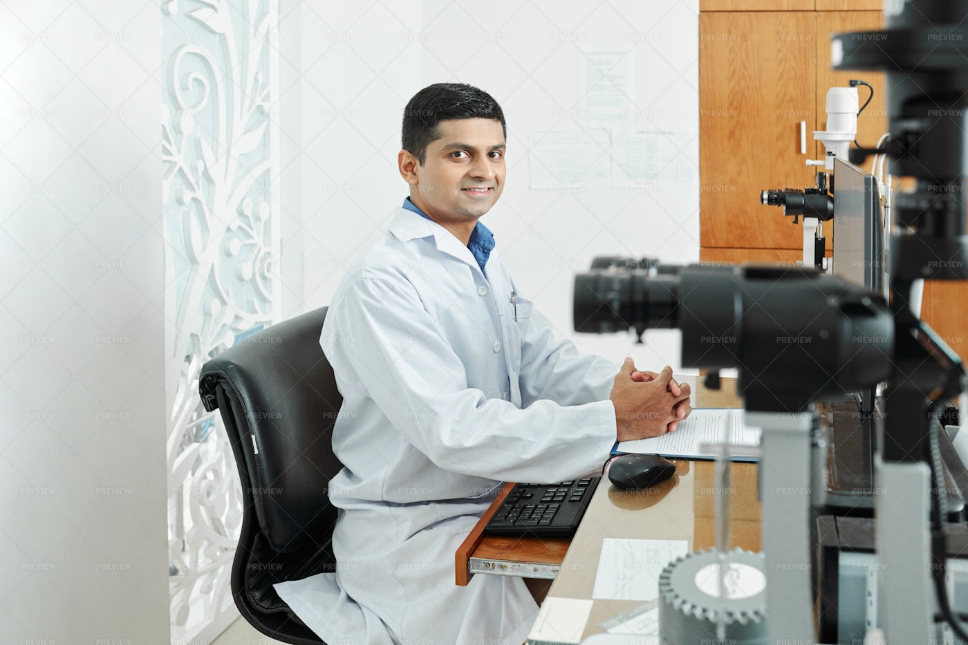 Indian Doctor Working At Office: Stock Photos