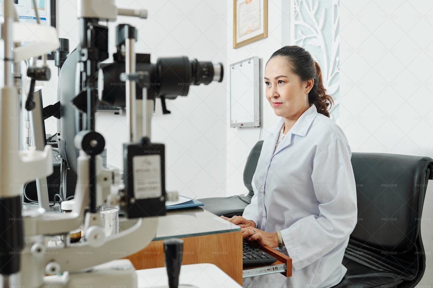 Ophthalmologist Working At Office: Stock Photos