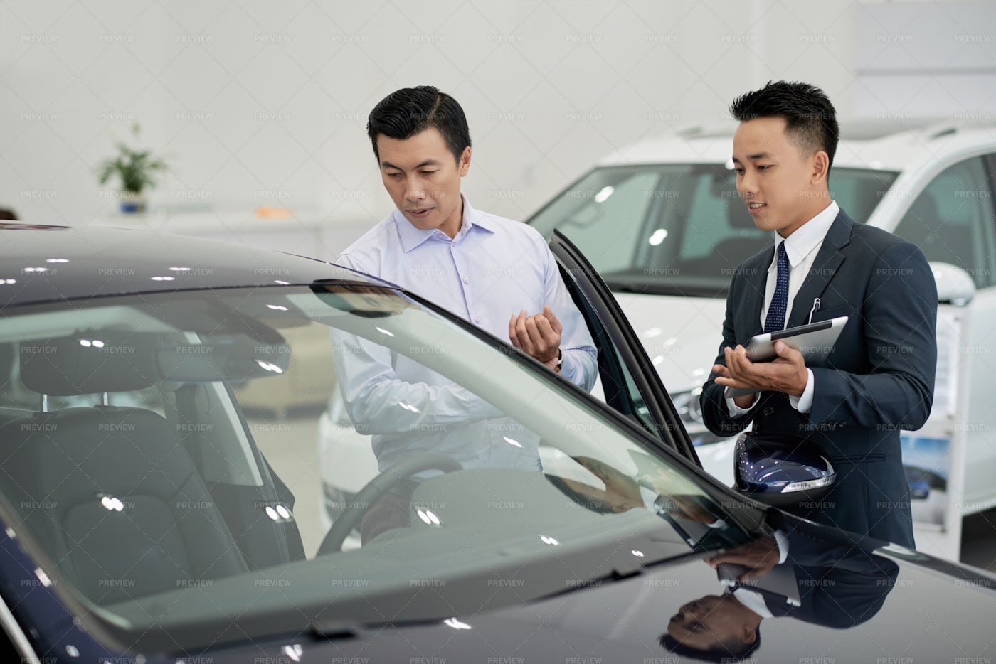 Dealership Working Taking To Client: Stock Photos