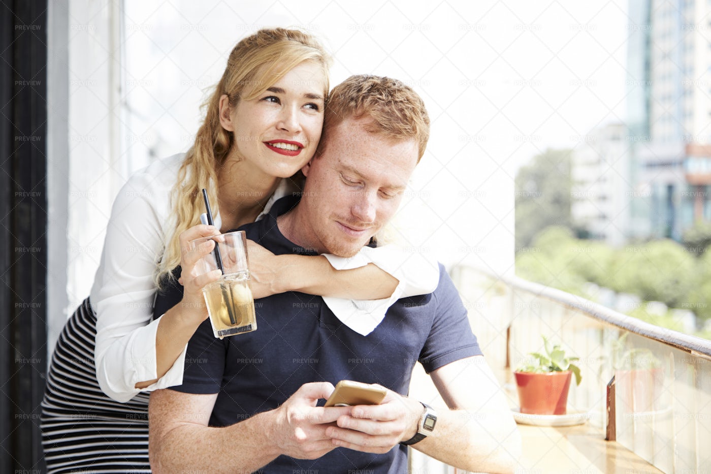 Cheerful Woman Hugging Boyfriend: Stock Photos