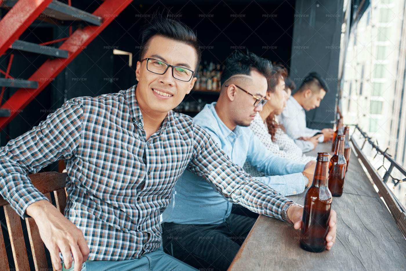 Businessman Drinking Beer At Bar: Stock Photos