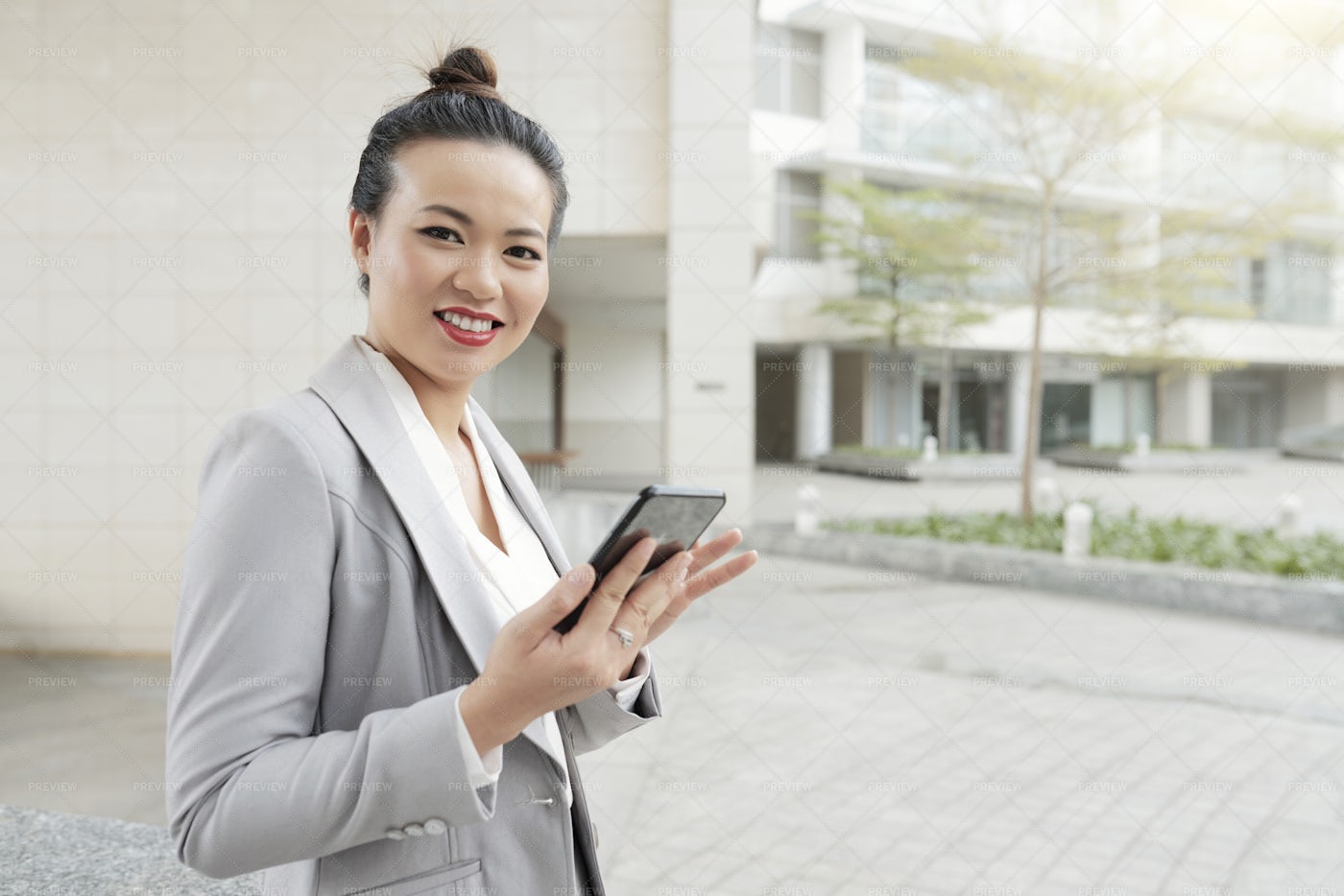 Businesswoman With Mobile Phone In The: Stock Photos