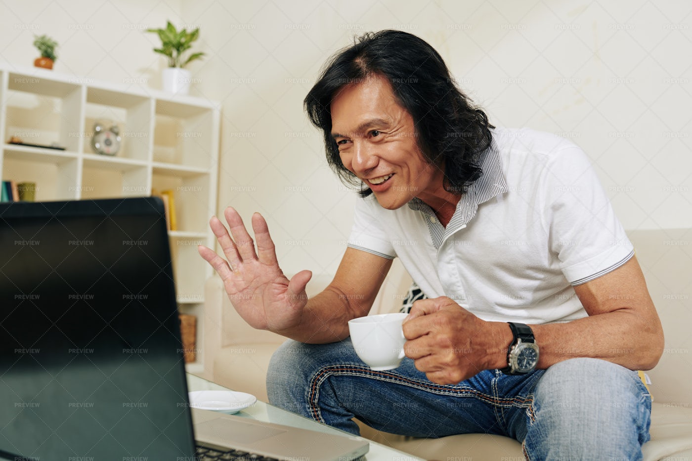 Man Video Calling Friend: Stock Photos