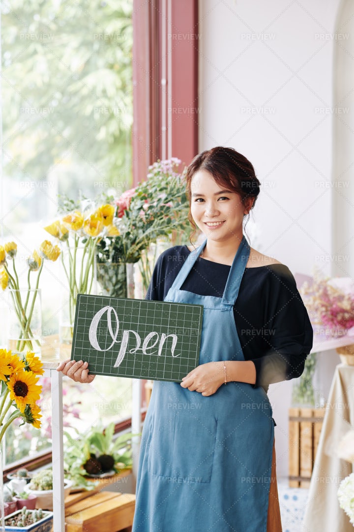 Lovely Florist Holding Open Sign: Stock Photos