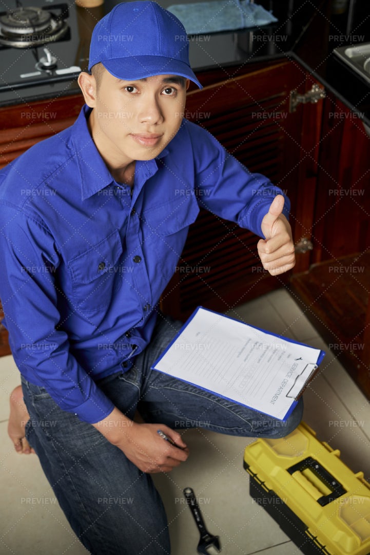Repairman Does His Work Well: Stock Photos