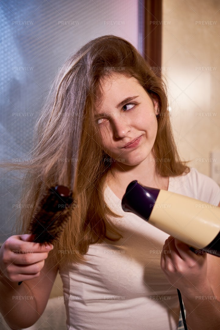 Woman Drying Up Her Hair: Stock Photos
