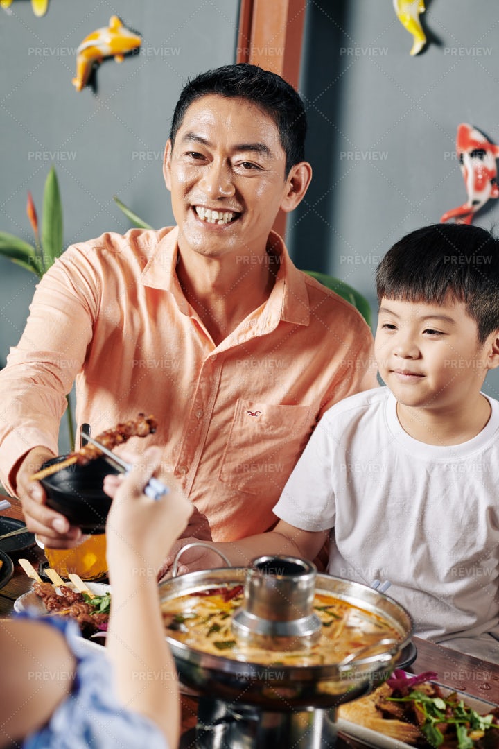 Father Having Dinner With Kids: Stock Photos