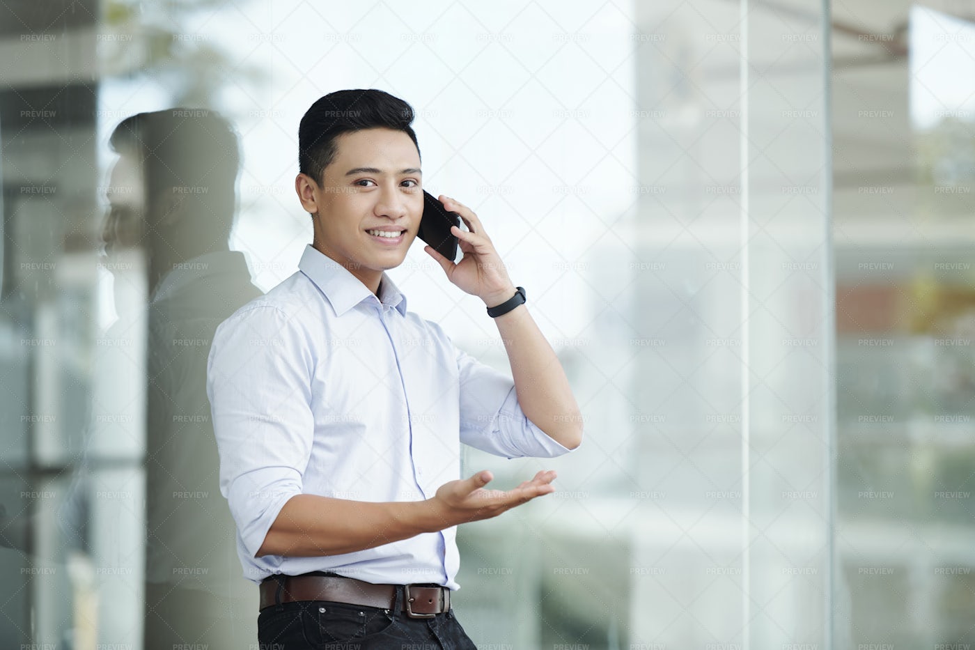 Confident Businessman Calling On Phone: Stock Photos