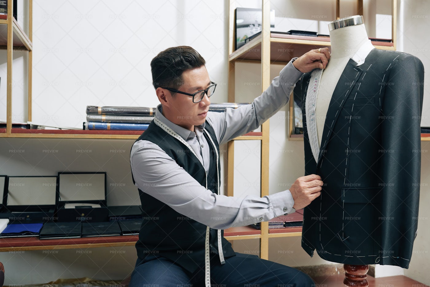 Tailor Measuring Suit Jacket: Stock Photos