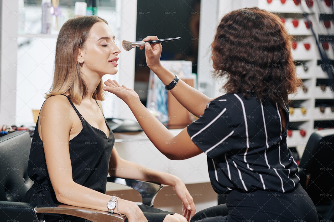 Make-up Artist Applying Finishing Face: Stock Photos