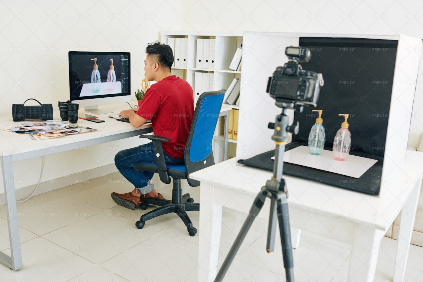 Photographer Retouching Photos On: Stock Photos