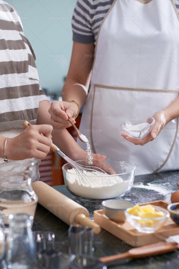 Mother And Daughter Making Dough: Stock Photos