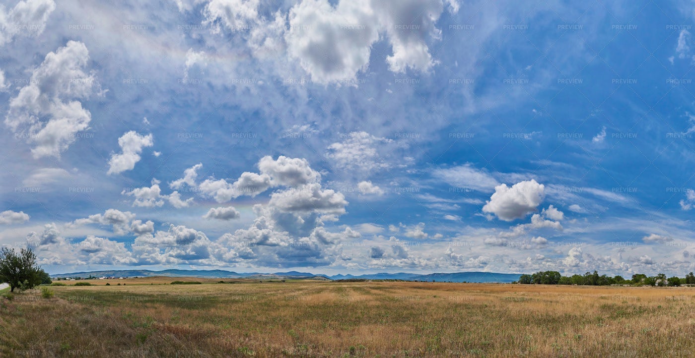 Clouds Over A Field - Stock Photos | Motion Array