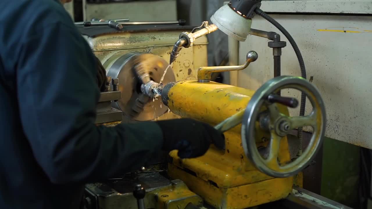 Industrial Worker Using A Lathe Stock Video Motion Array