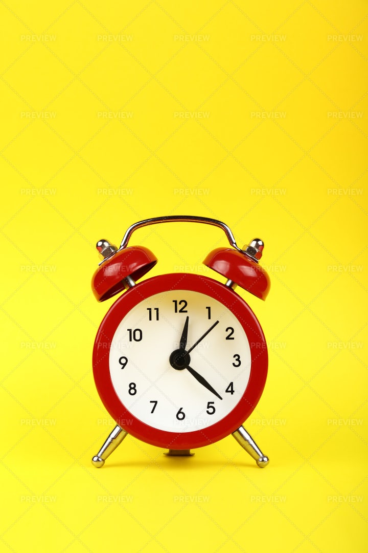 Alarm Clock On Yellow: Stock Photos
