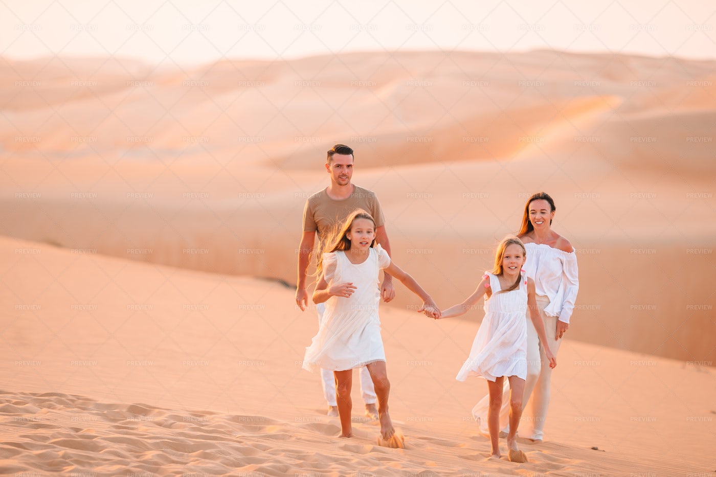 Family Walking In The Desert: Stock Photos