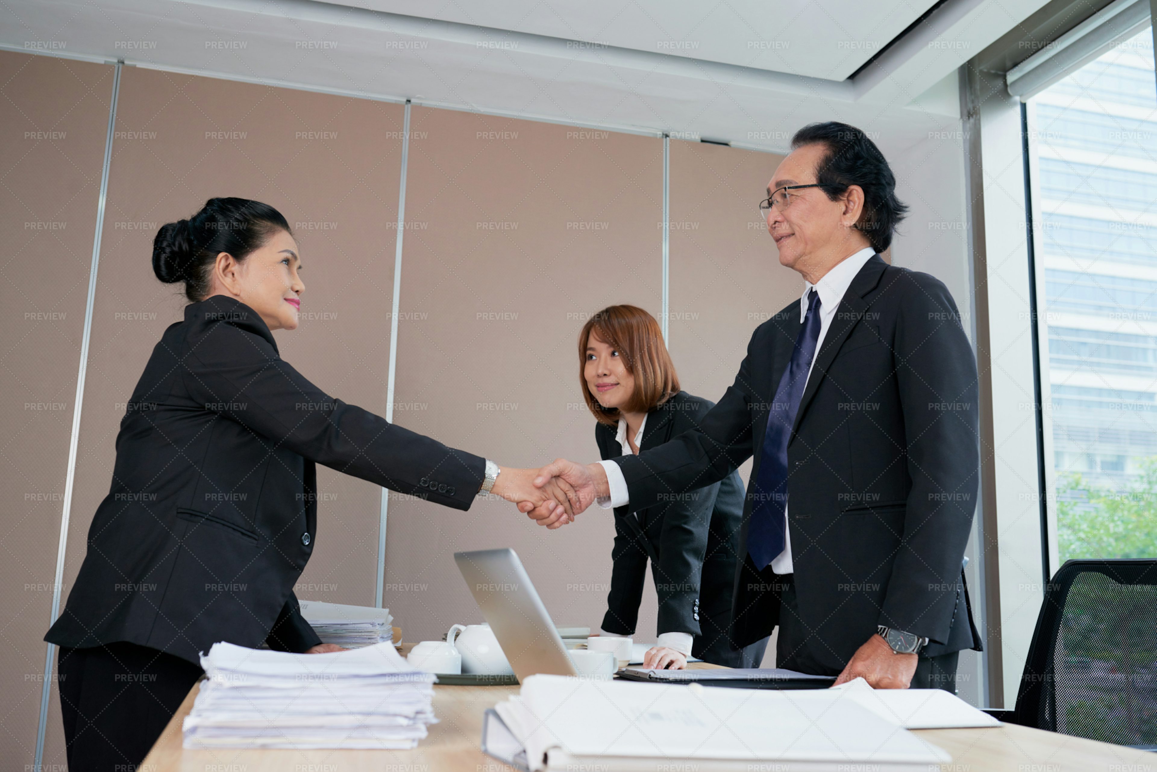 Business People Shaking Hands - Stock Photos | Motion Array