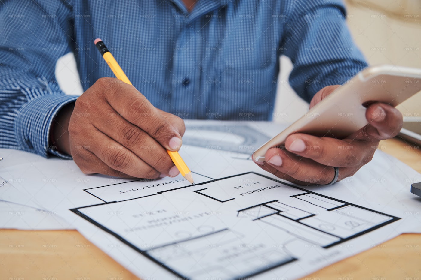 Employee With Smartphone Working On...: Stock Photos
