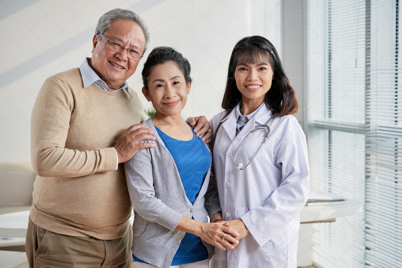 Asian Doctor With Senior Patients: Stock Photos
