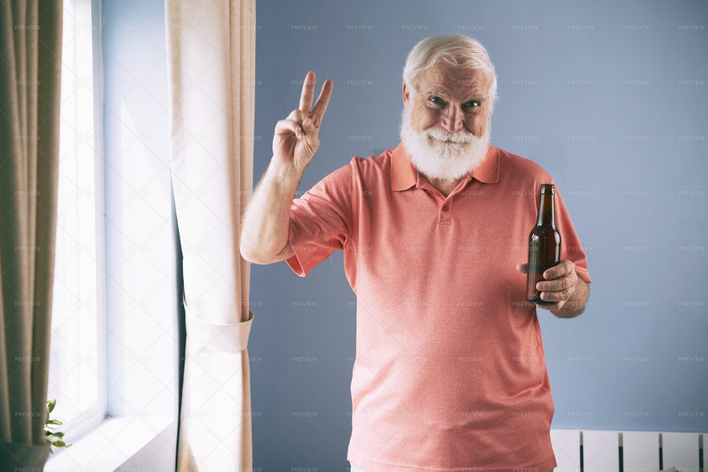 Man Enjoying Beer At Home: Stock Photos
