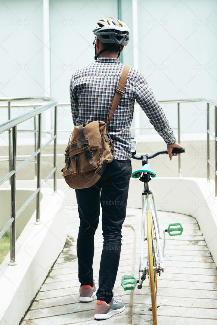 Man Walking With Bike: Stock Photos