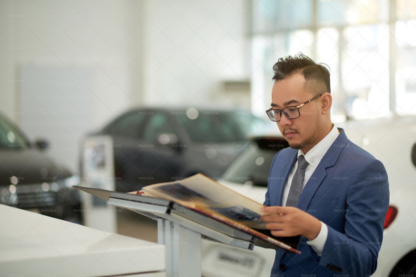 Potential Customer At Car Showroom: Stock Photos