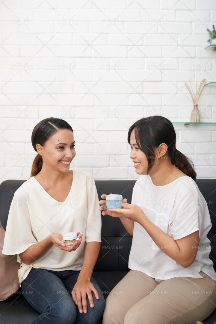 Friends Discussing Creams: Stock Photos