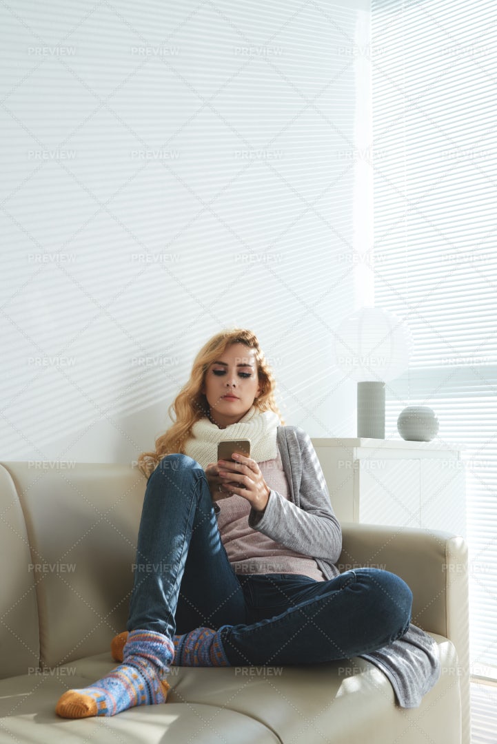 Texting Woman Resting At Home: Stock Photos