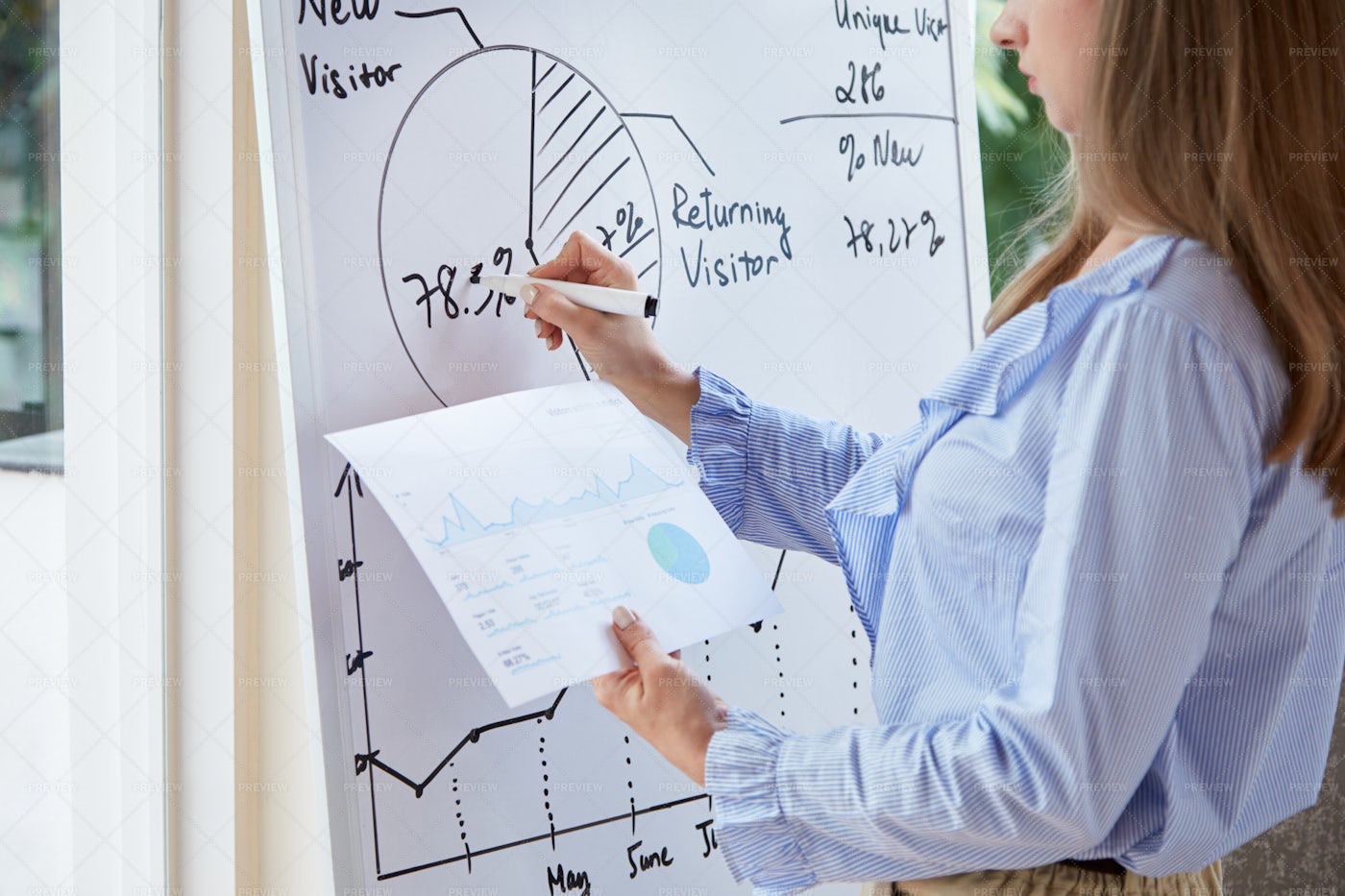 Businesswoman Copying Diagram From...: Stock Photos