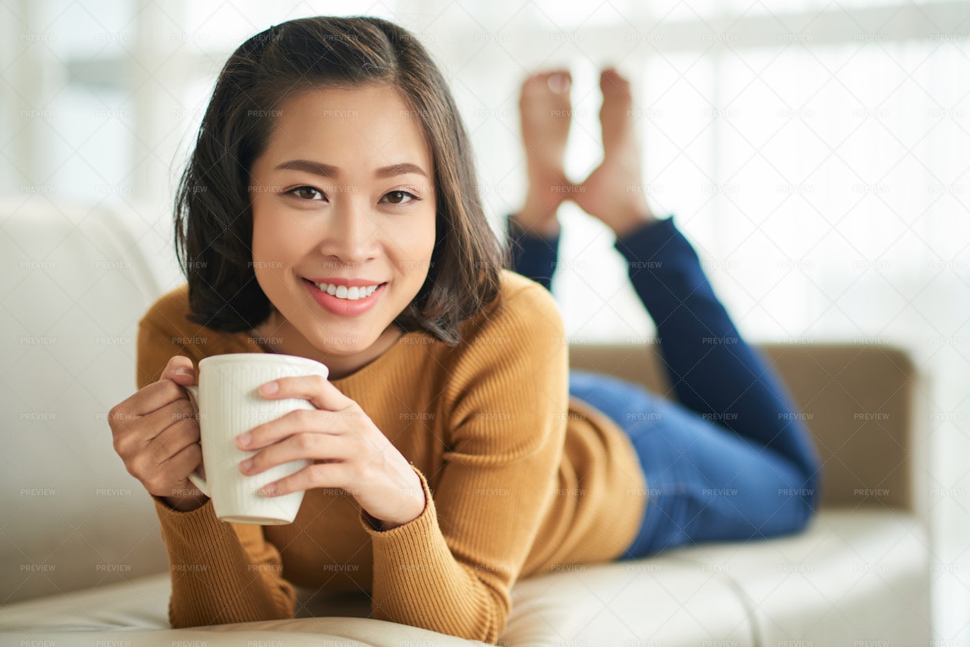 Young Woman Resting On Sofa: Stock Photos
