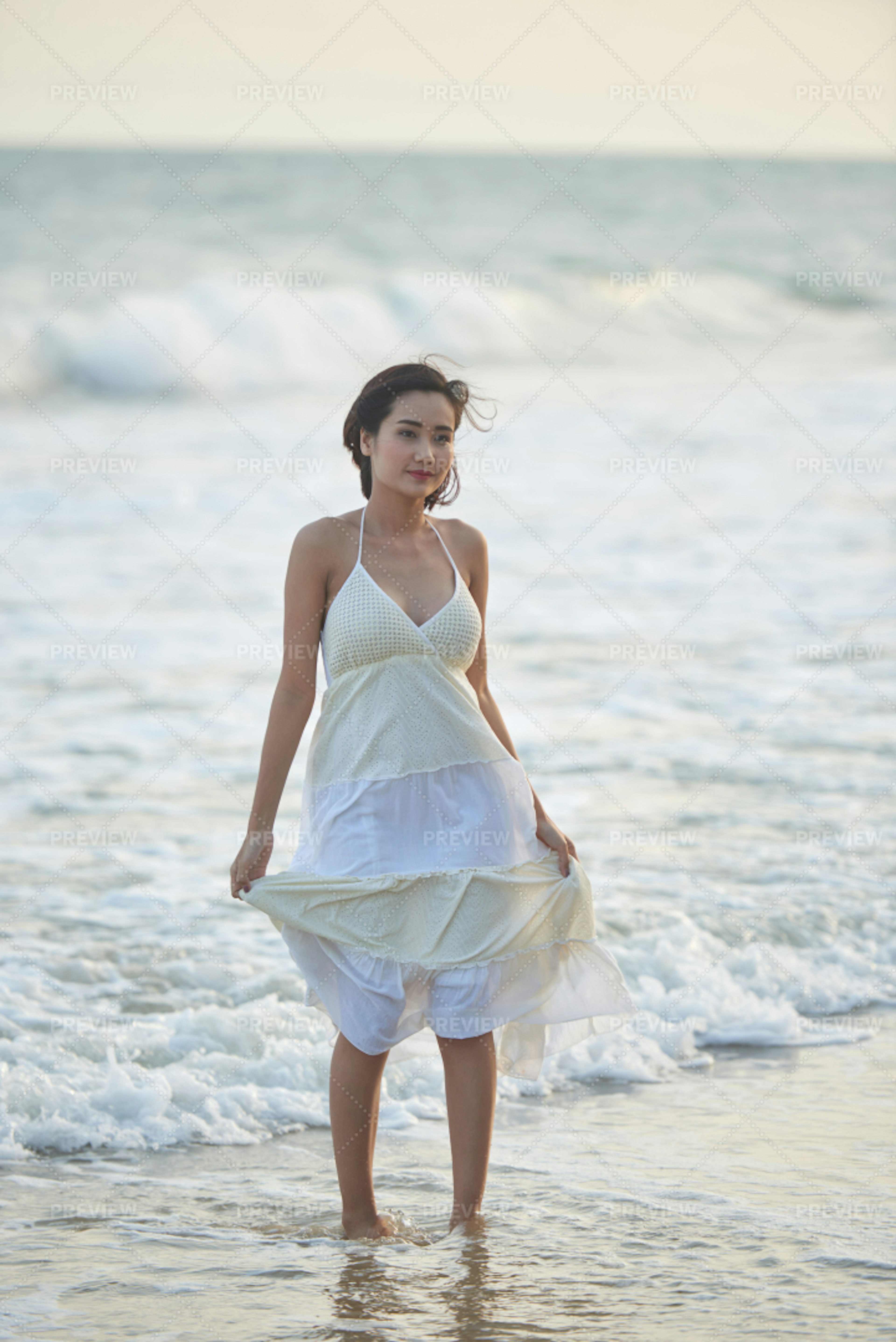 Pretty Woman On The Beach - Stock Photos | Motion Array